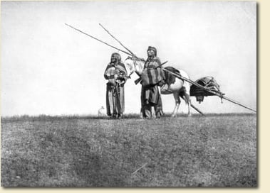 The Blackfoot used a travois to move their belongings. This one is pulled by a horse, but dogs were also used to pull smaller travois. Photograph by Edward Curtis, Glenbow Archives NA-1700-156