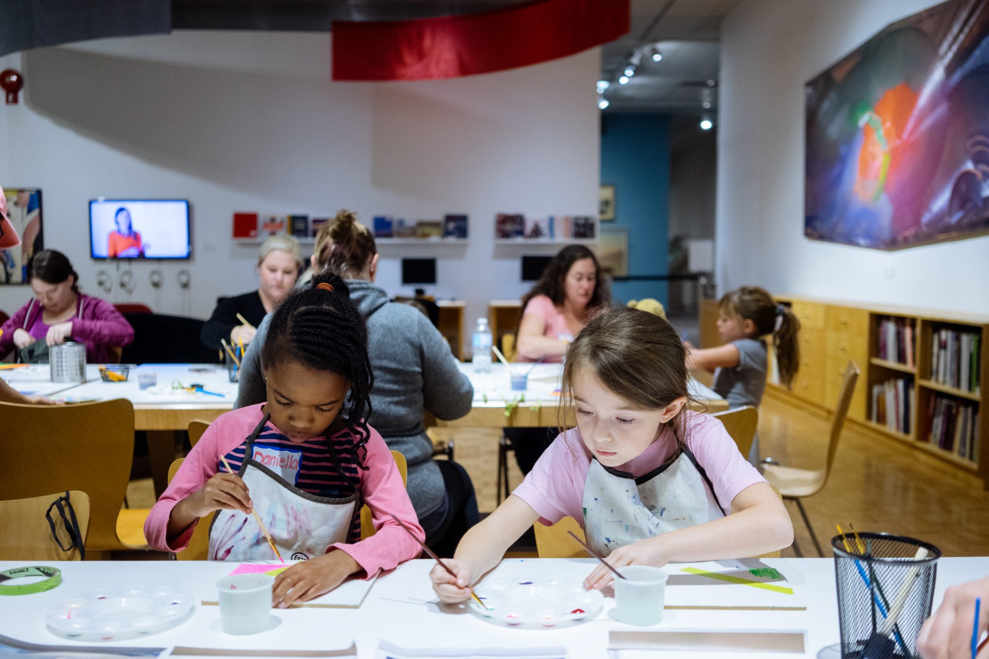 Two girls working together at a desk