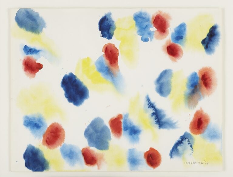 A watercolour painting of abstract shapes in red, blue, and yellow.