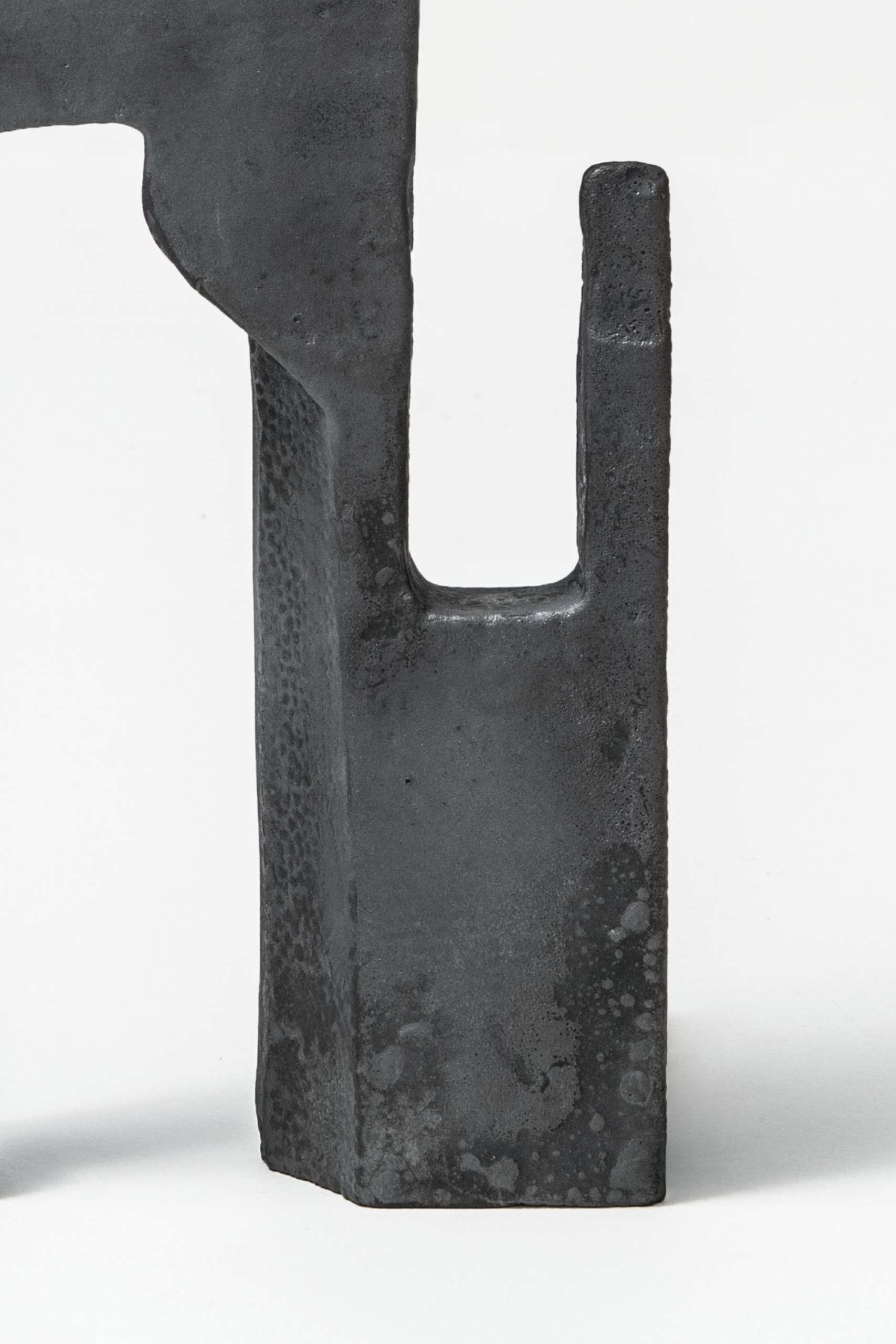 A detail image of an angular metal sculpture.